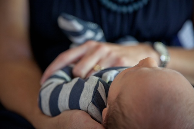 Baby being held - by T. Shaw via Pexels (CC0 1.0)